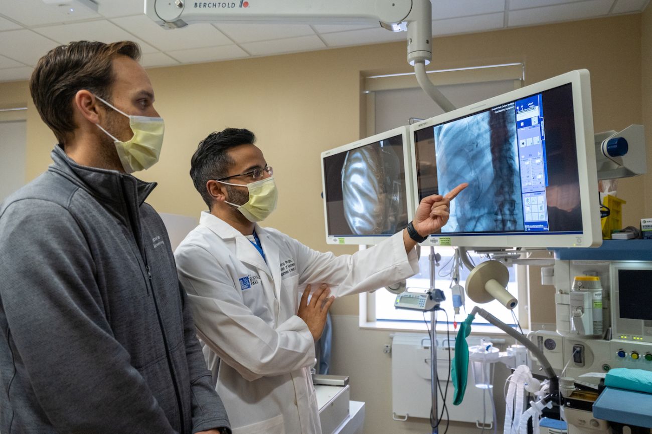 Dr. Andrew Bain and Dr. Anoop Prabhu evaluate a scan 