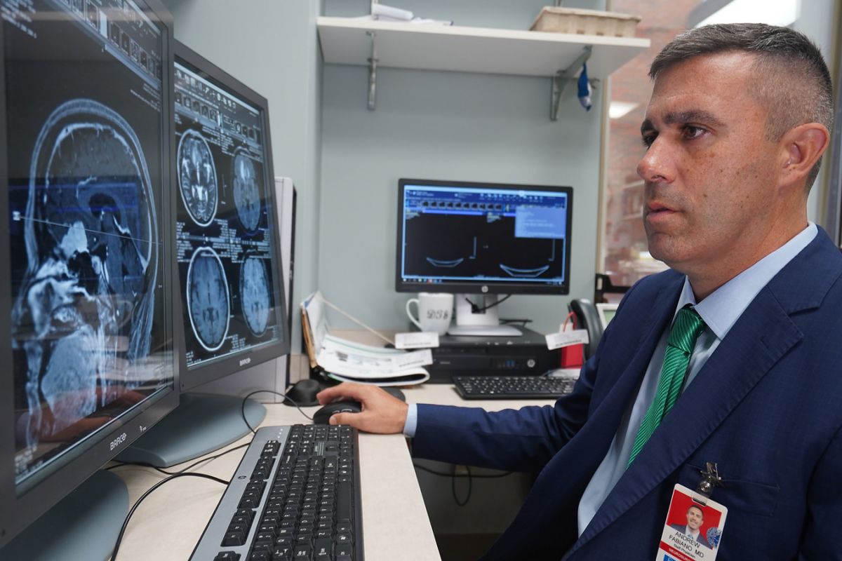 Dr Fabiano looking at brain scans
