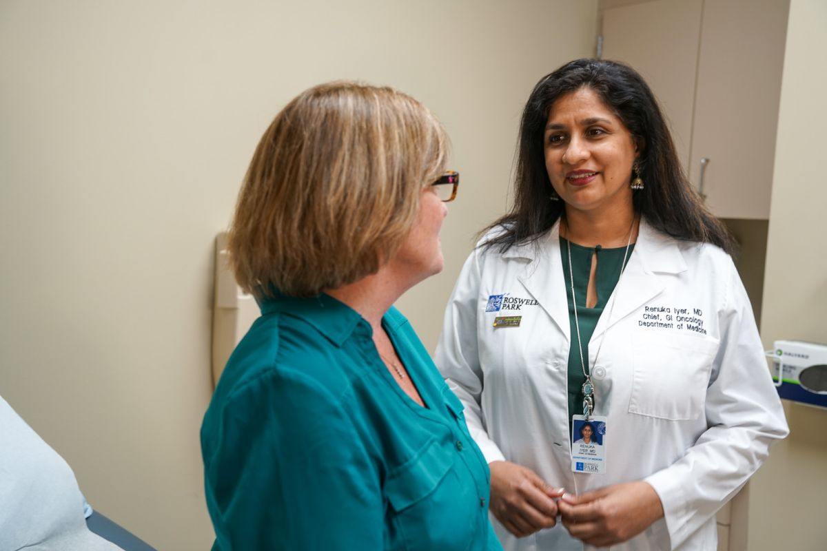 Renuka Iyer with Patient in clinic