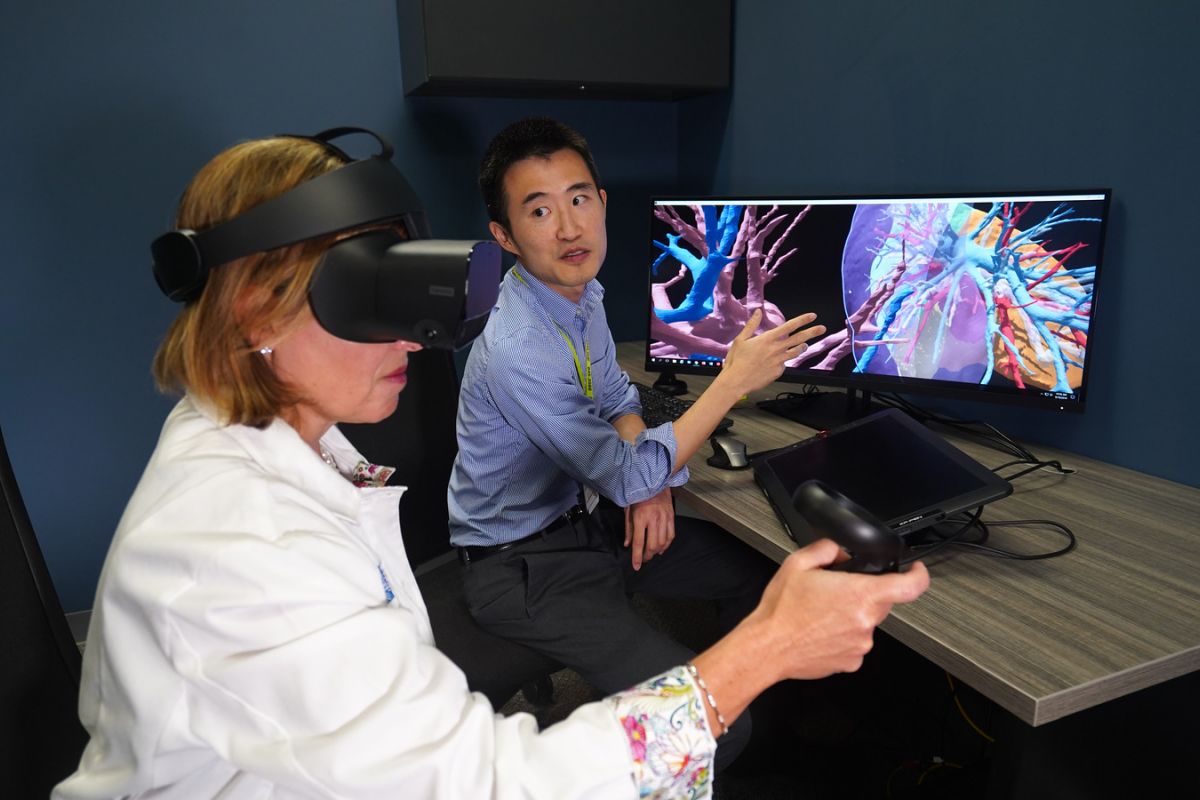 Dr. Larson Hsu shows Dr. Ermelinda Bonaccio how 3-D Imaging can be used to identify the size and shape of tumors.