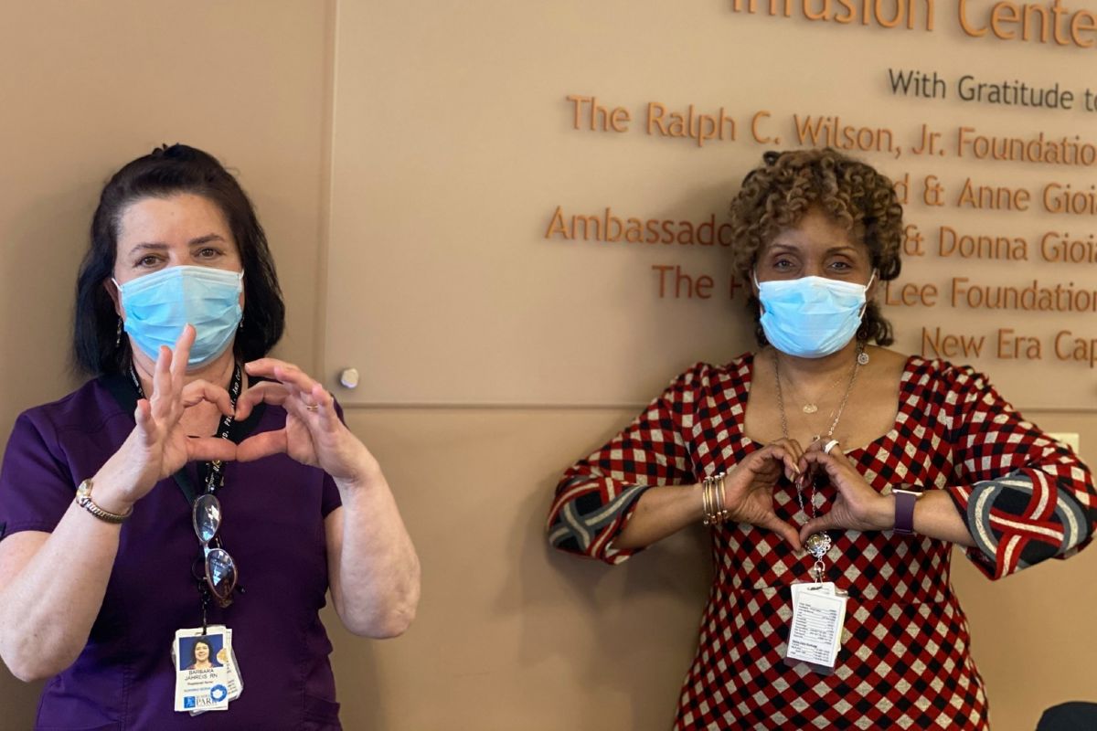 Staff giving heart hands