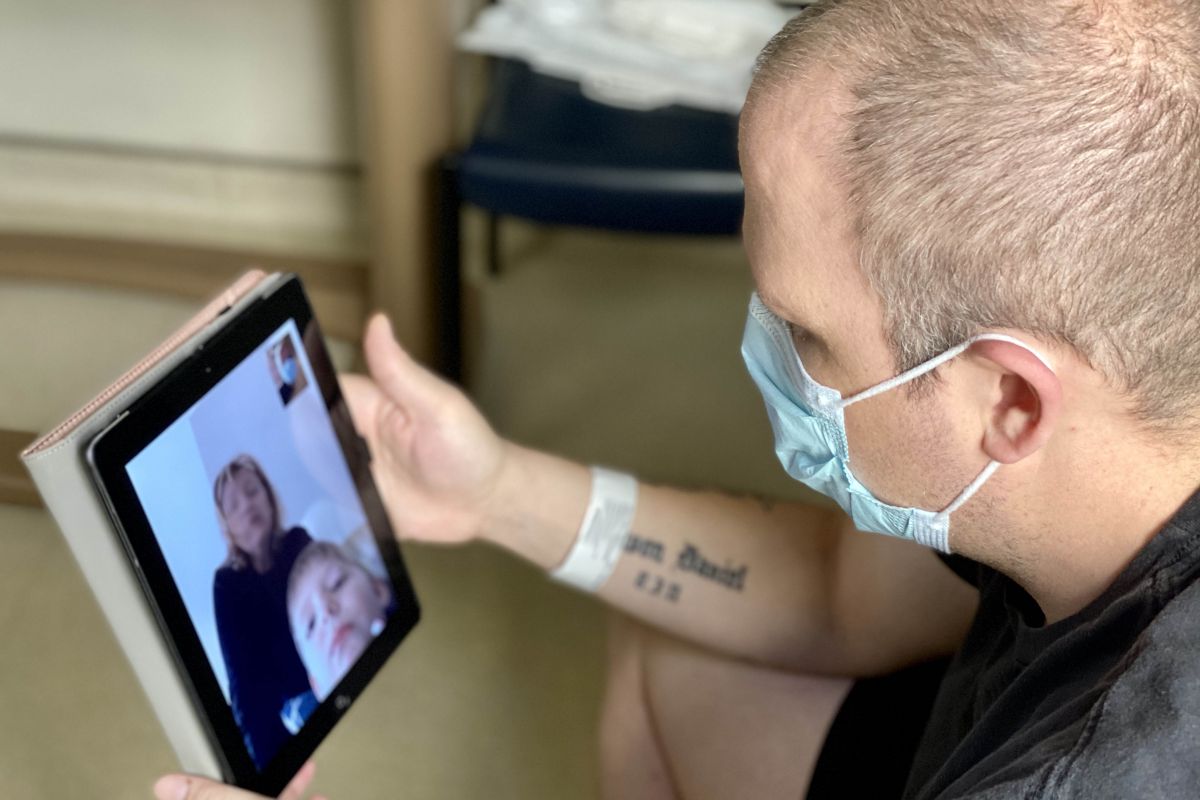 Patient video chatting with family on iPad