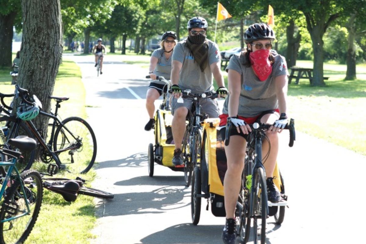 a family ride their bikes in the Ride for Roswell