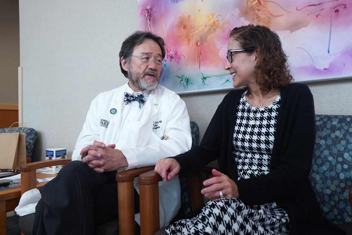 Dr. Philip McCarthy discusses treatment options with a patient.