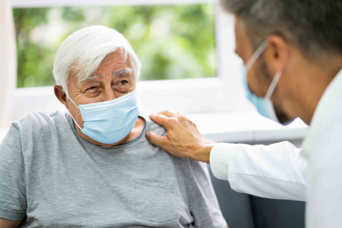 Older patient with doctor