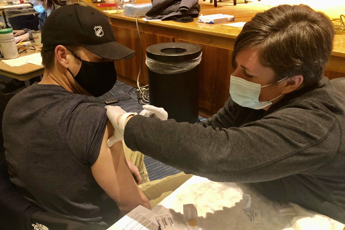 Buffalo Firefighter Chris Whelan gets the COVID-19 vaccine at Roswell Park