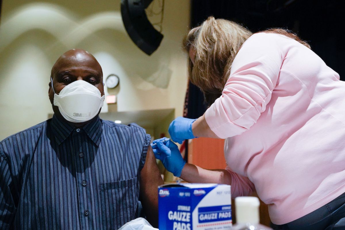 Man getting vaccinated.