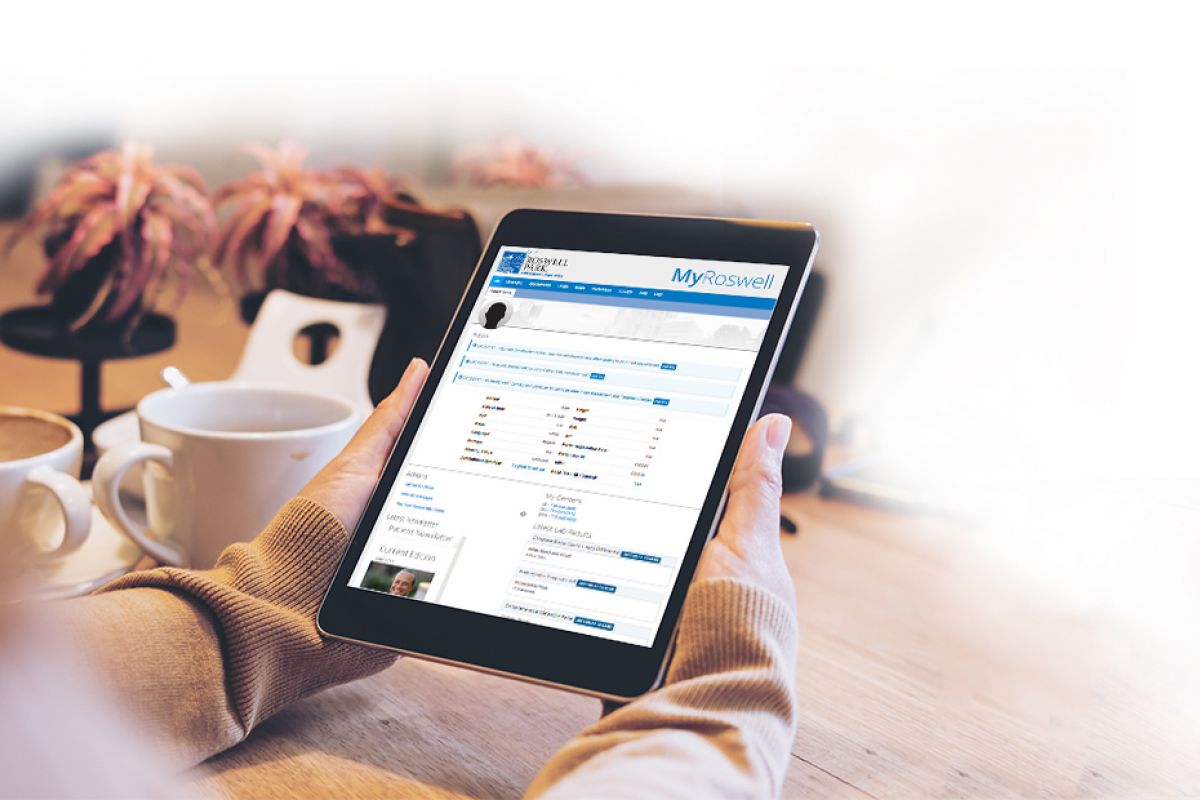 image of person using the MyRoswell patient portal on a tablet