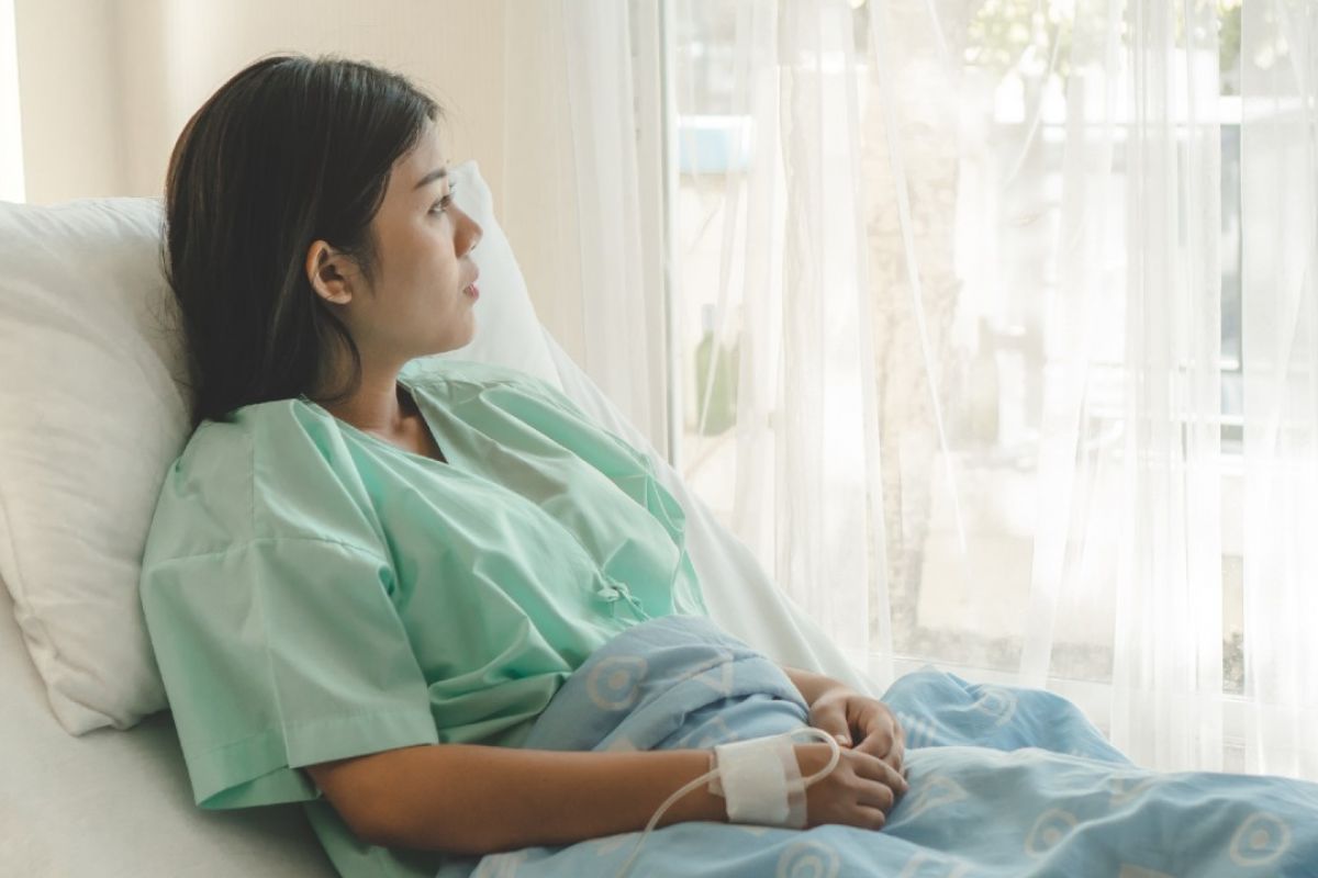 Young adult cancer patient in bed 