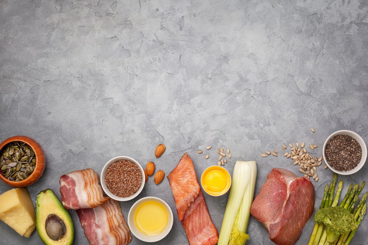 Fresh foods arranged on a grey background