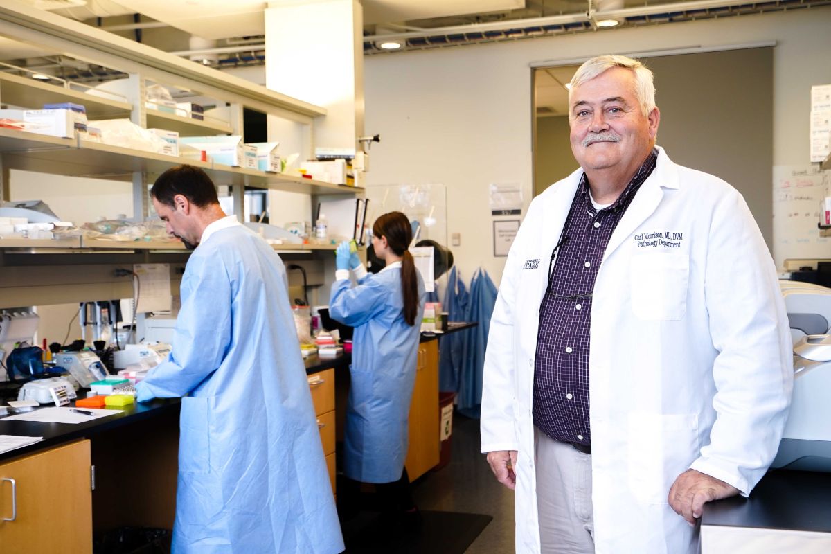 Dr. Carl Morrison with lab workers