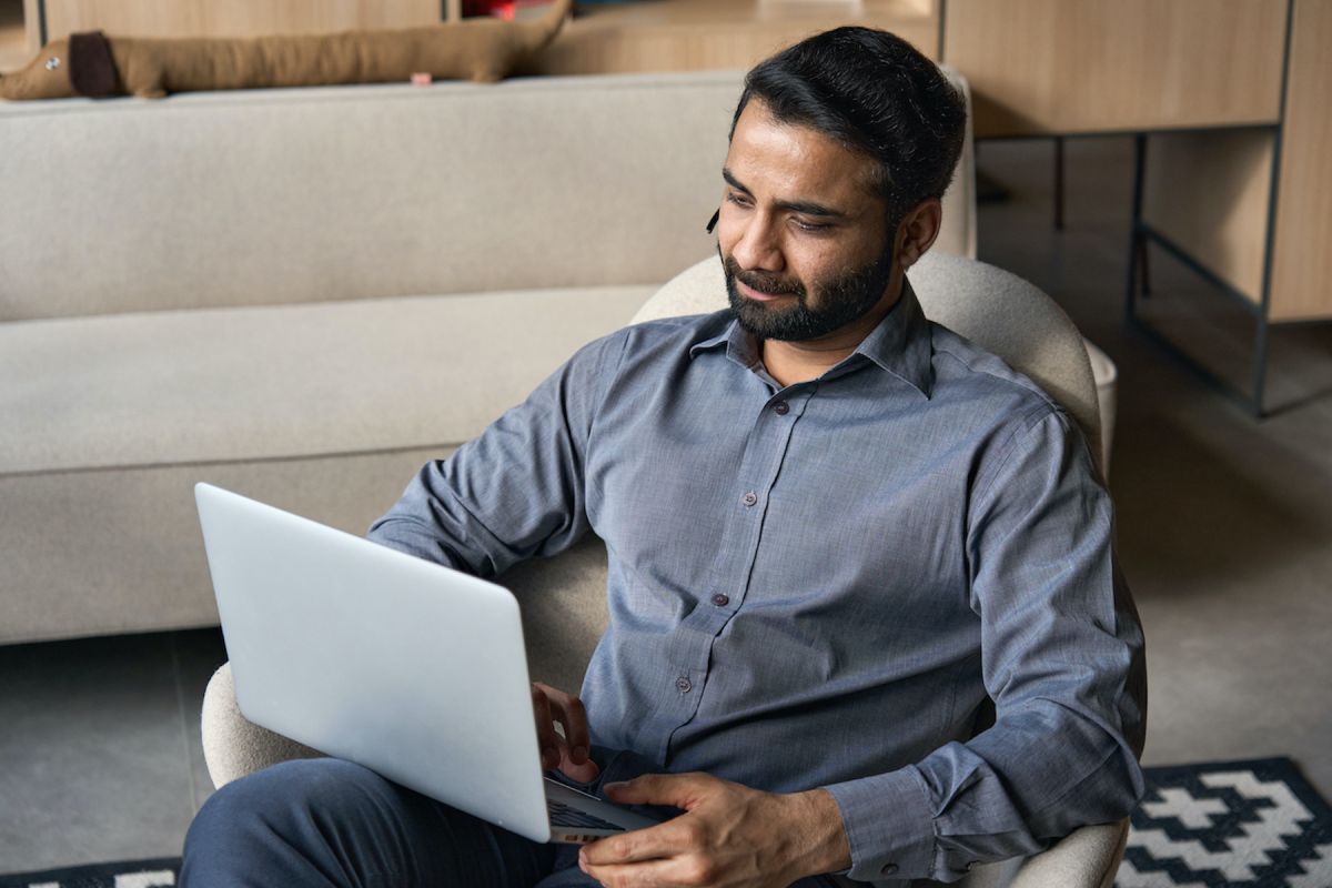 Man watching webinar on computer