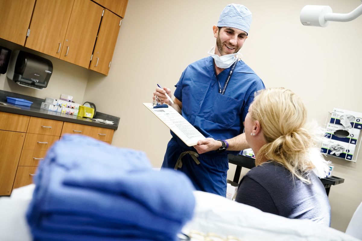 Dr. Michael Bax interacting with a patient - Moh's surgery