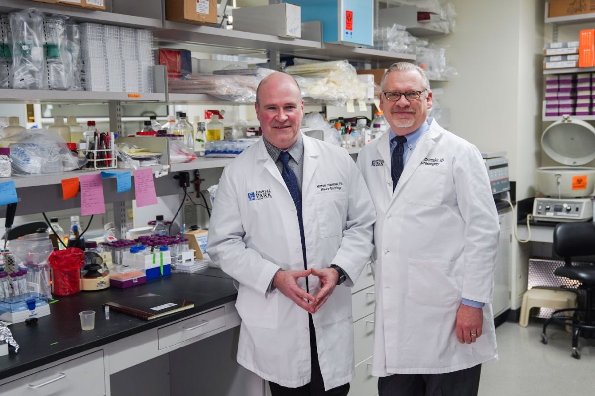 two doctors stand in a lab