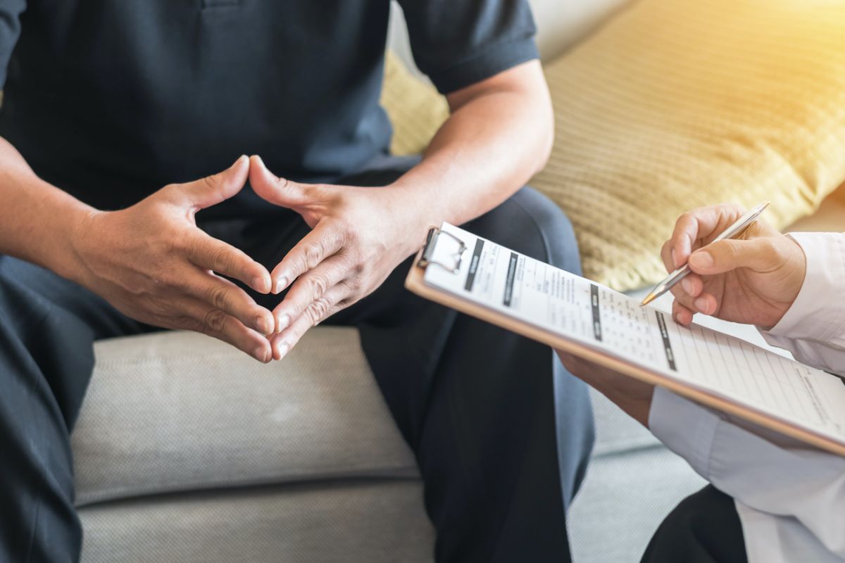 Man sitting with doctor having a consultation