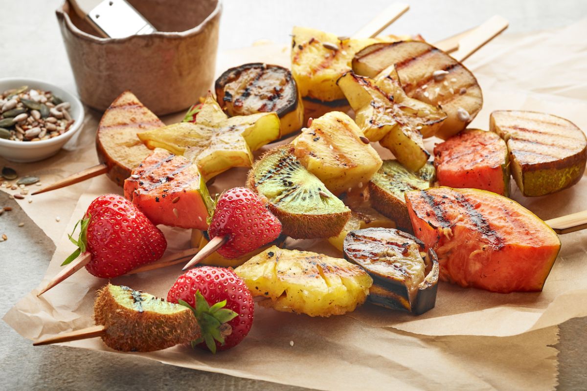 Fruit on skewers after being grilled - stock
