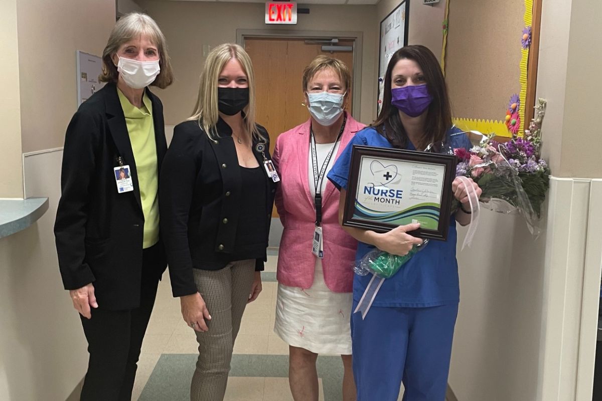 Nina Mohsini, far right in blue scrubs, was named Roswell Park's Nurse of the Month for August. 