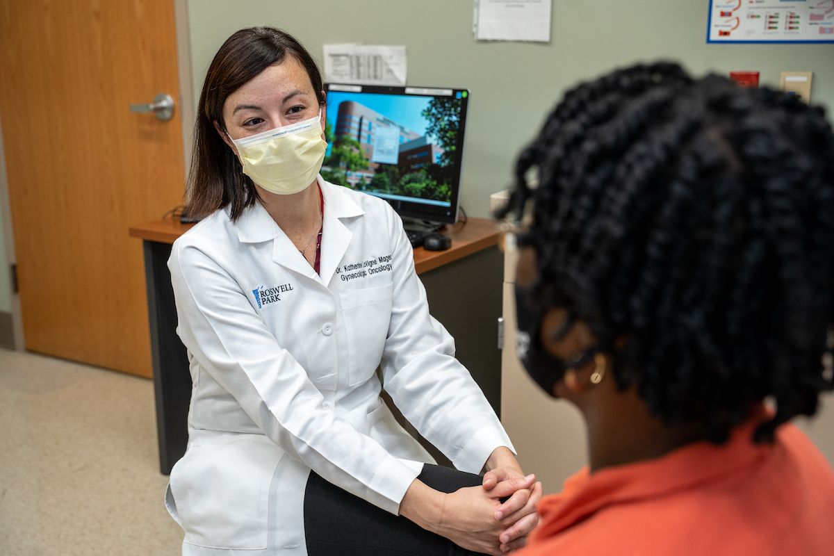 Dr. Katherine Lavigne Major in clinic with a patient - August 2022