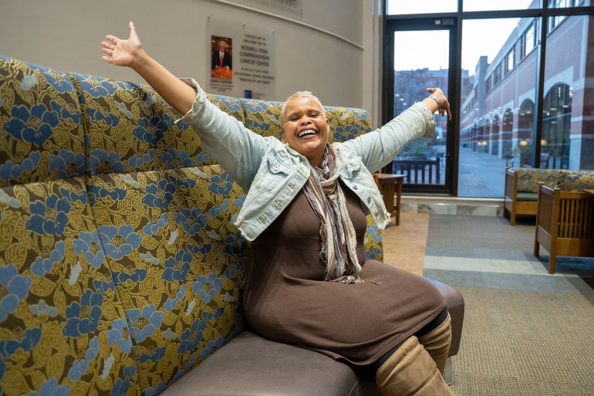 Former happy patient with outstretched arms