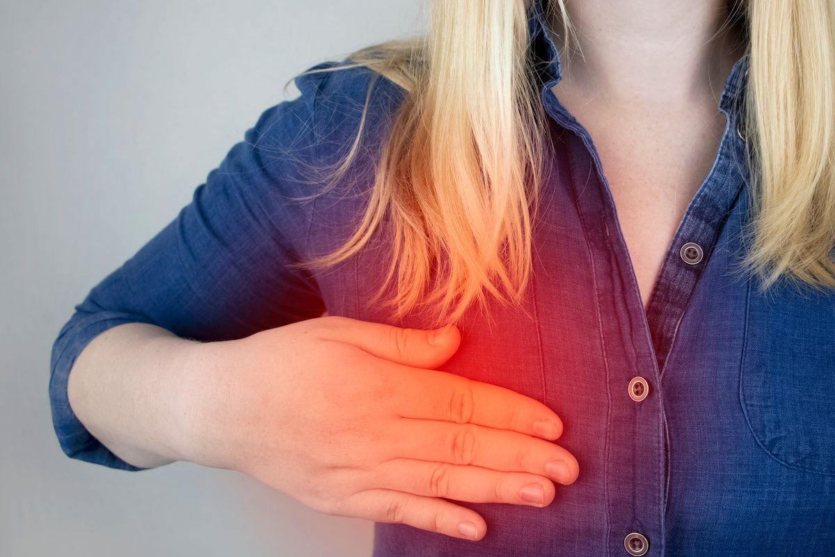 Woman experiencing pain in her breast