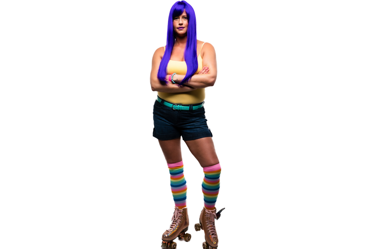 Krystyn poses in her rollerskates and purple wig for the Elevate Salon