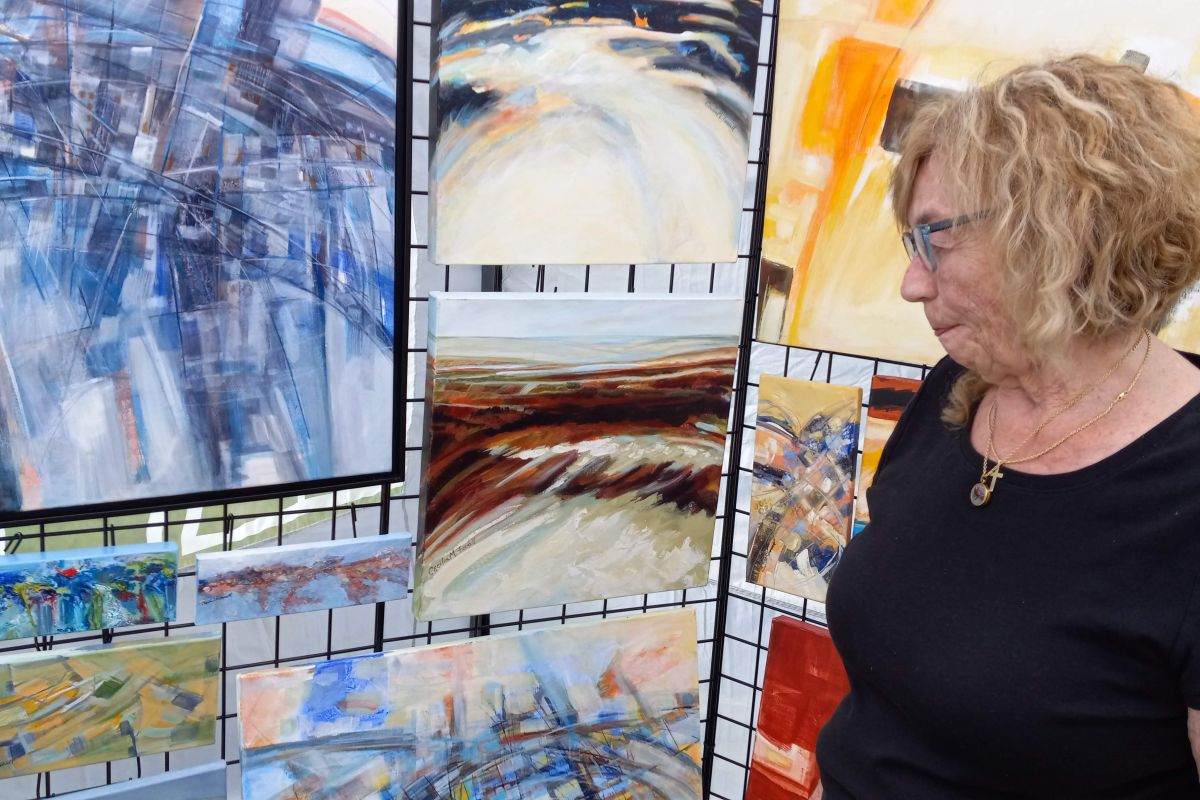 Cecilia Farrell with some of her paintings. 