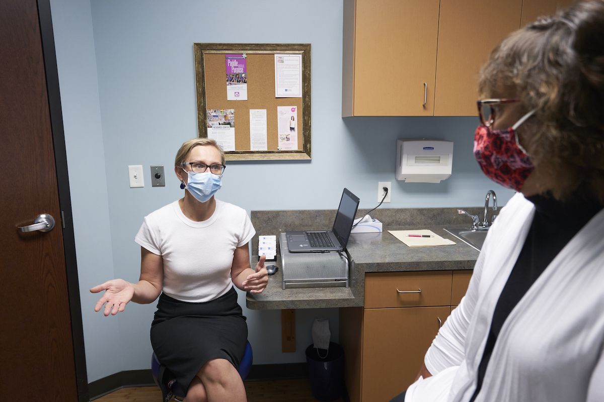 Dr. Mariola Poss consults with a patient in clinic at Breast Care of WNY