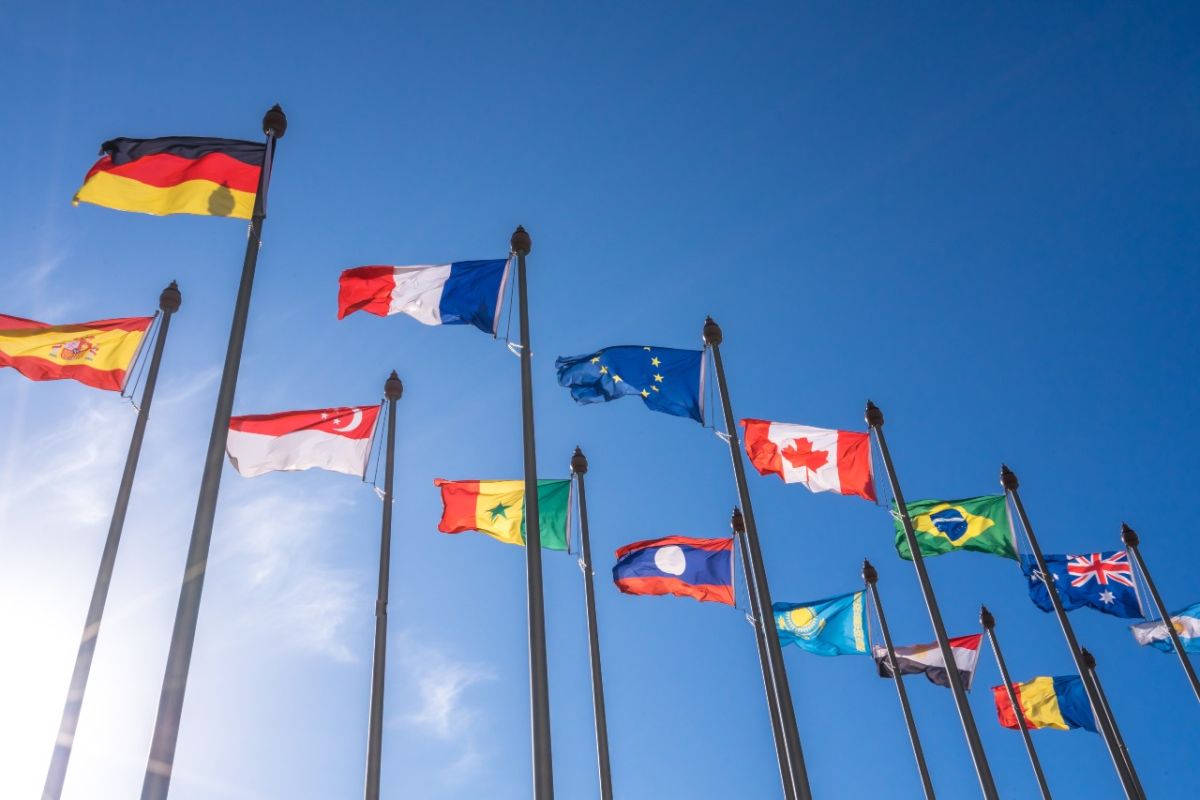 13 international flags flying in the sky