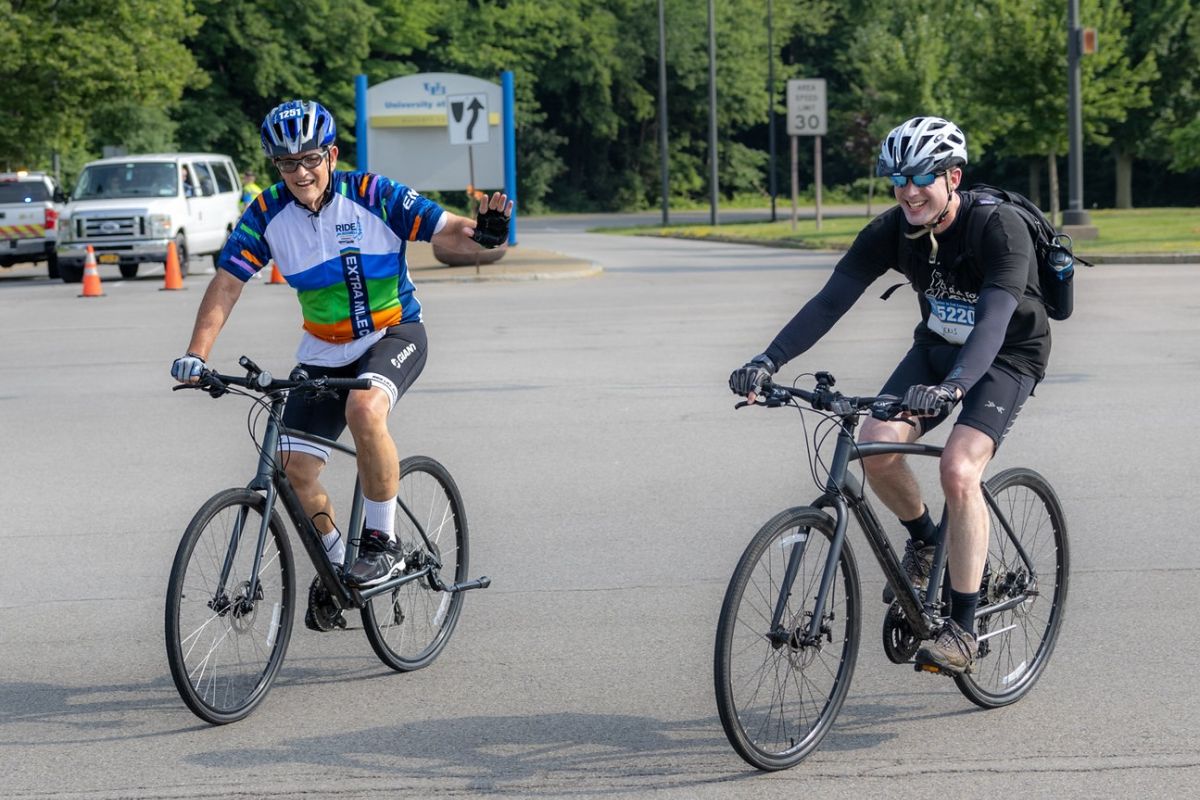 Paul Leo, left, and Dr. Jens Hillengass ride together during the Ride for Roswell.