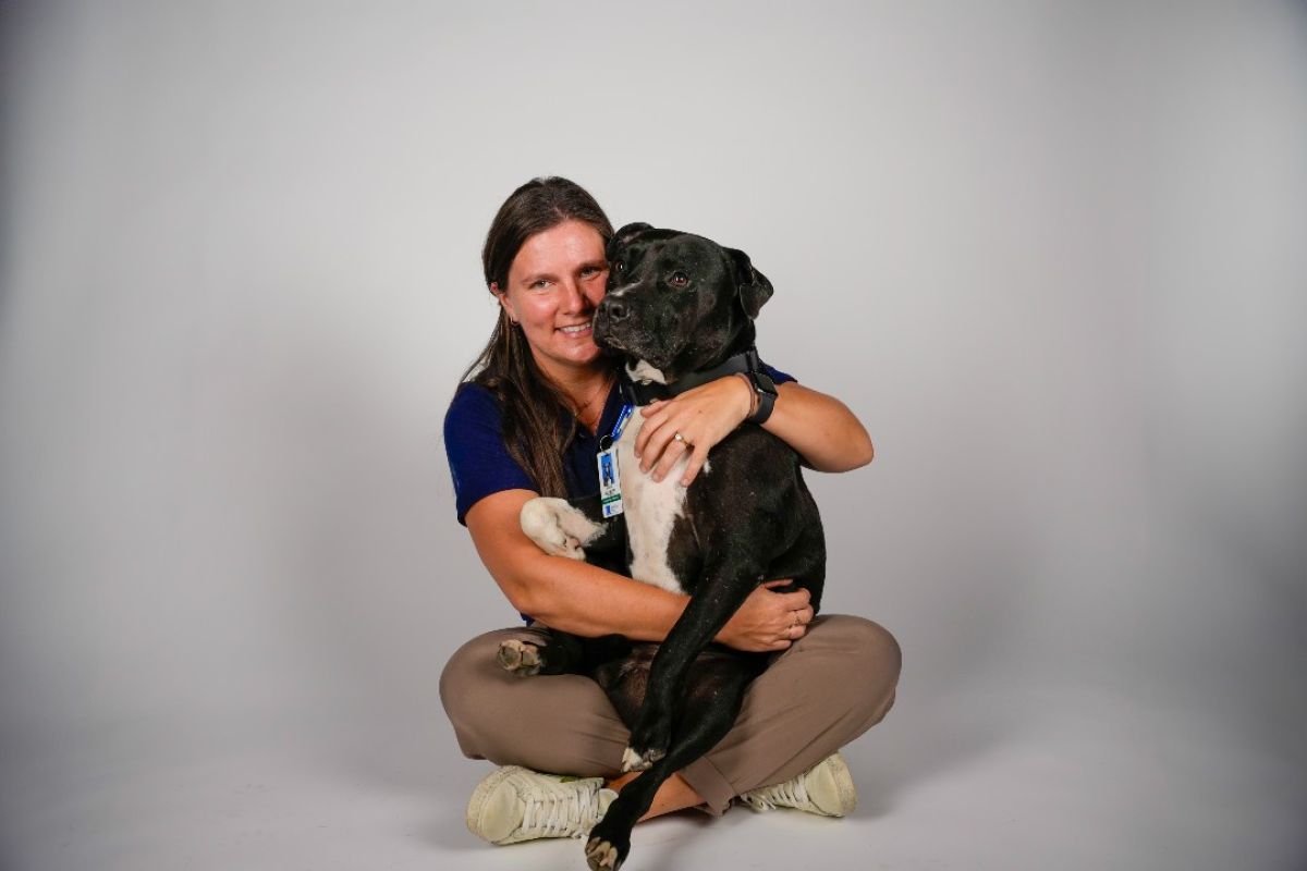 Molly Webster, RN, BSN, holds her therapy dog, Zoar.