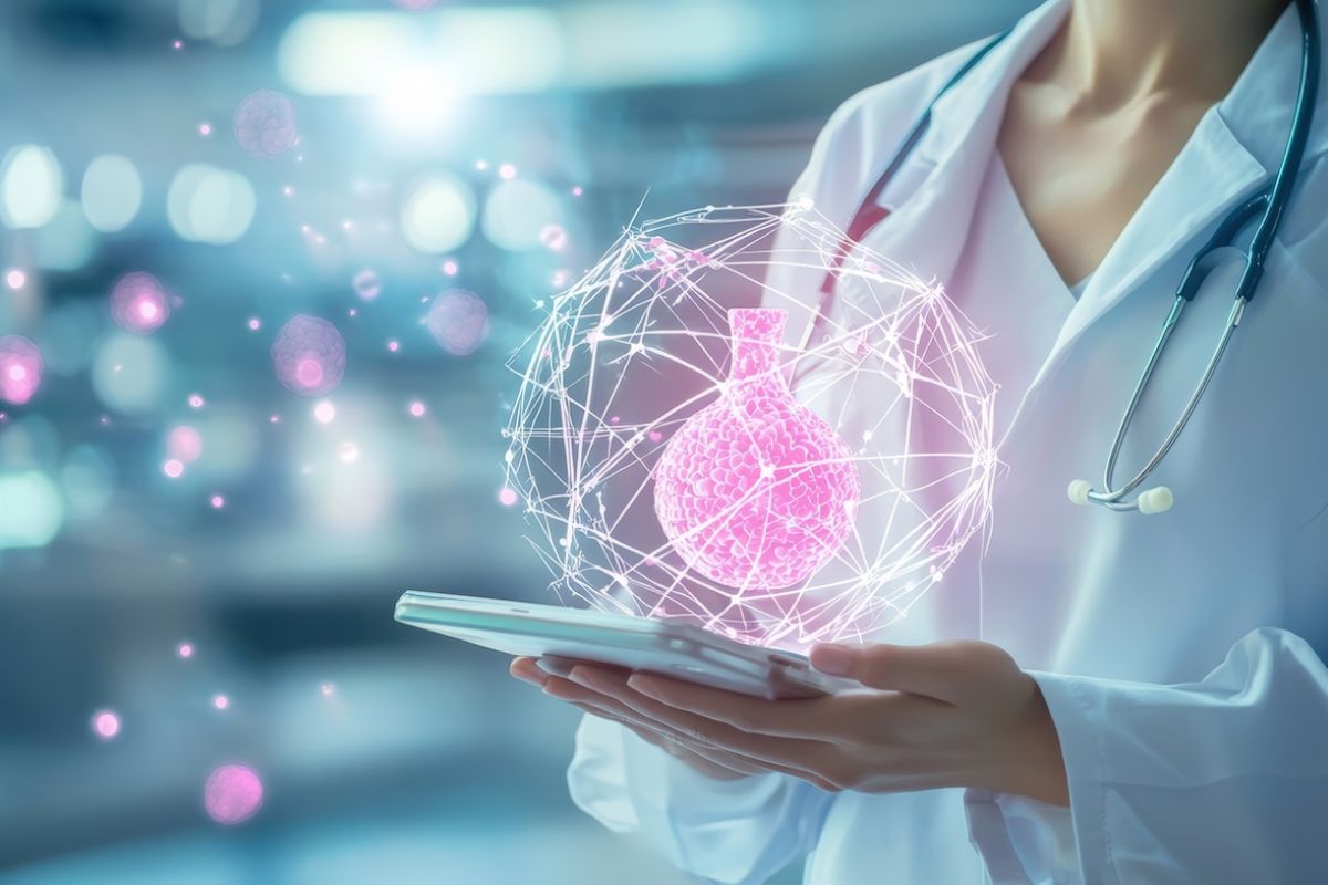 Breast cancer doctor holds a tablet with a treatment icon above it