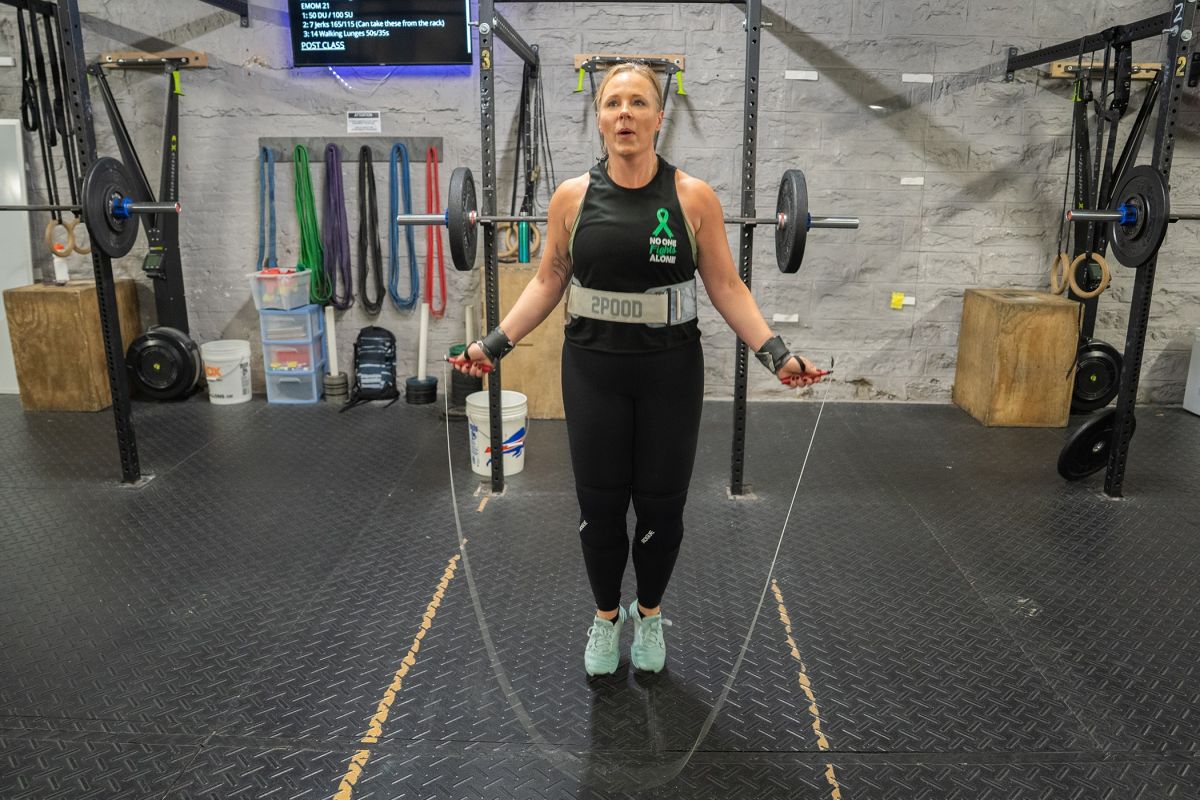 Doctor jumps rope in gym