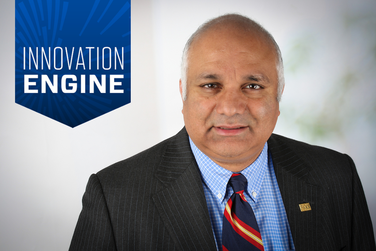 Dr. Guru smiles with a badge over the photo reading "innovation engine"