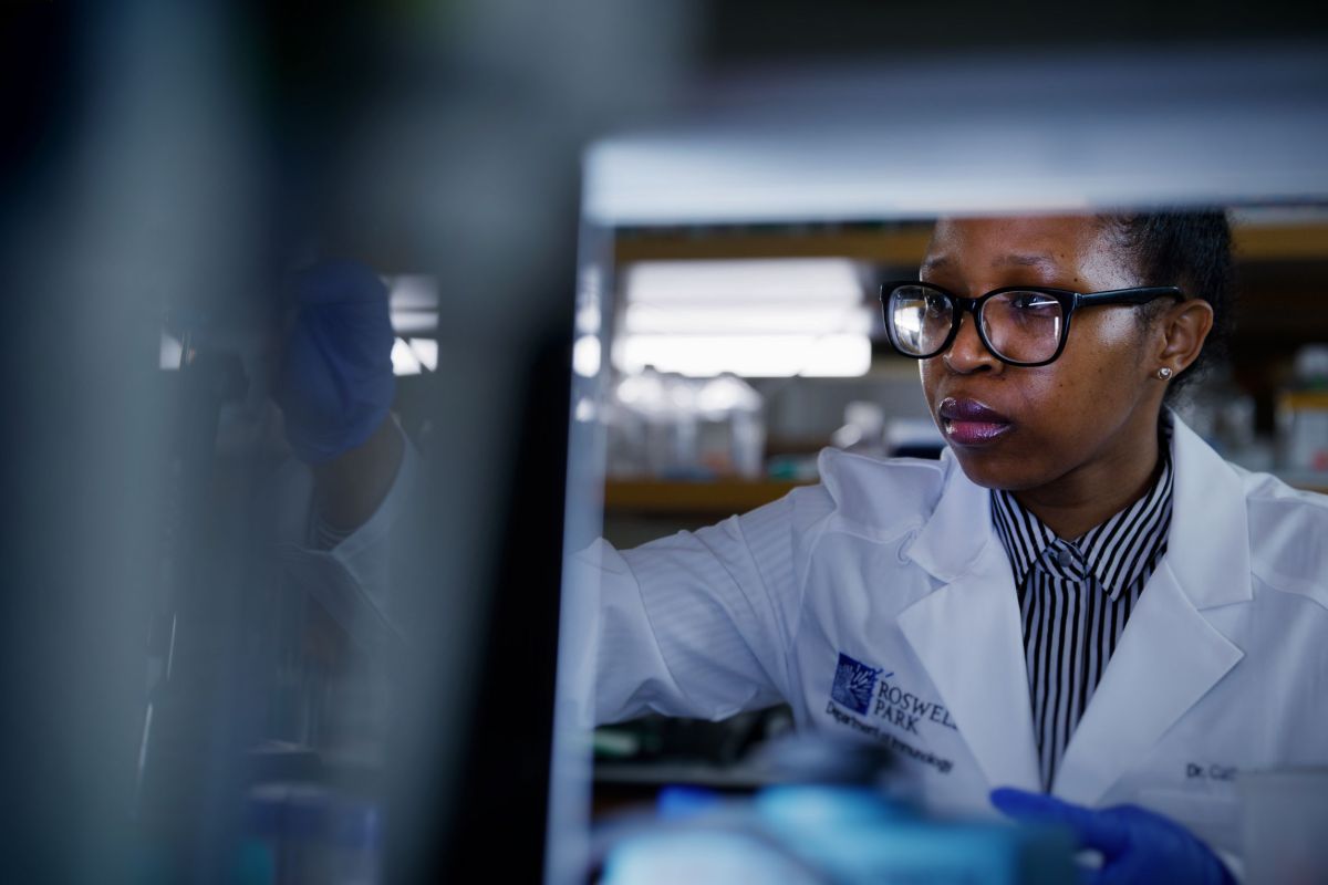 Doctor in lab coat doing research
