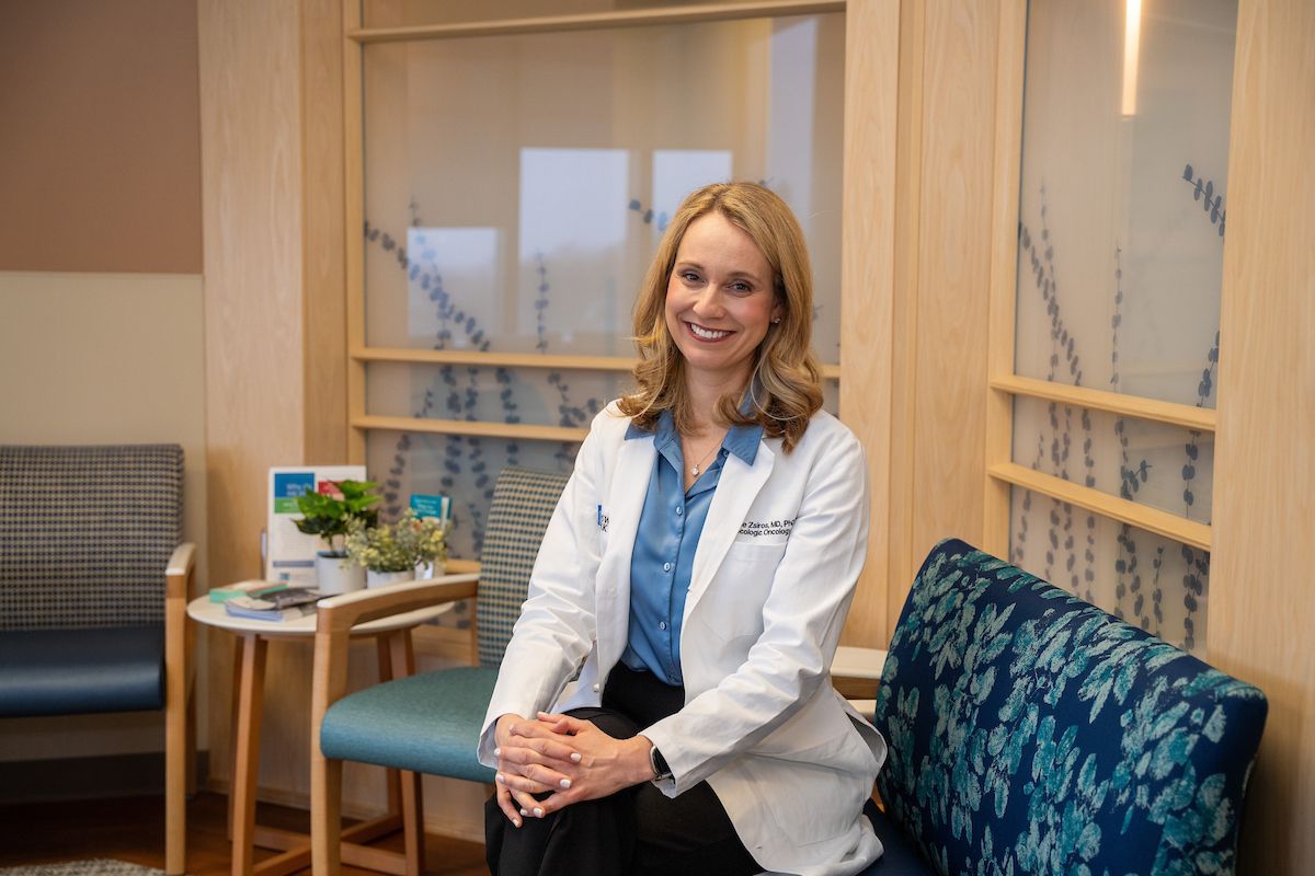 Gynecologic oncologist Dr. Emese Zsiros smiles at the camera in the GYN waiting room