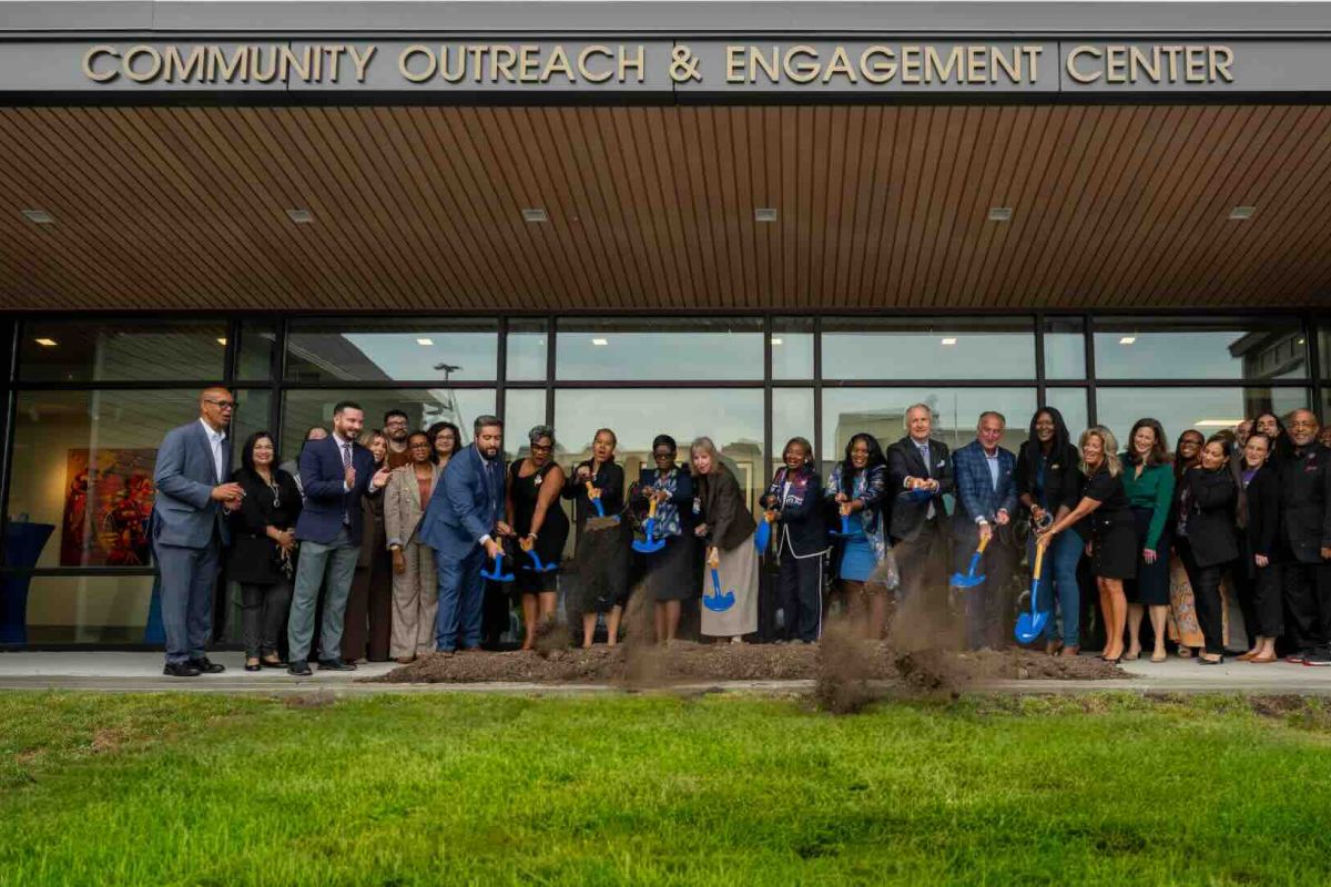 Group of people with shovels break ground on new building
