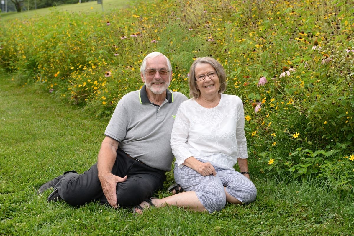 Esophageal patient William Strunk and his wife Patricia, pose in a fieldE