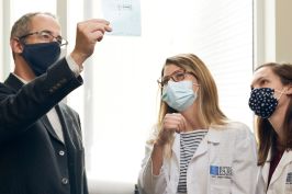 Scientists examining data in a lab