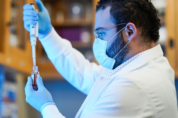 NicoTAR team member using a pipette