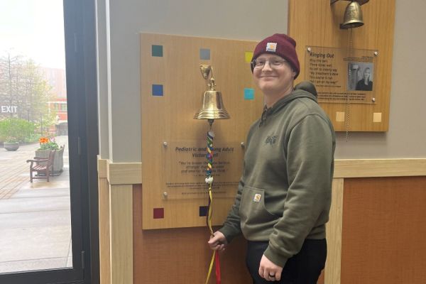 Jack Langdon rings the Victory Bell after finishing treatment.