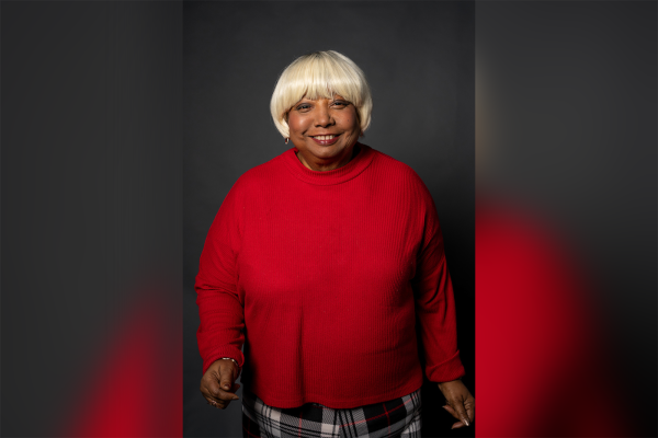 Annette Ford, breast cancer patient, poses for a photo while wearing a wig from the Elevate Salon