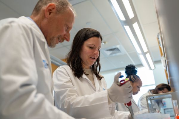 Two scientists working at a lab bench
