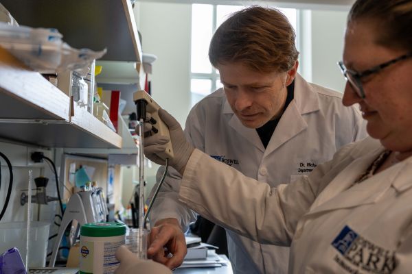 Two scientists working in a lab