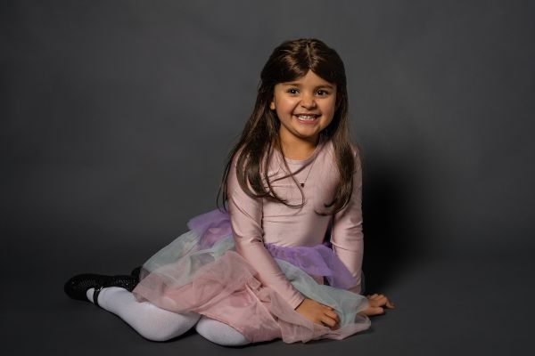 Vada Evanson, pediatric patient, poses for the Elevate Salon 