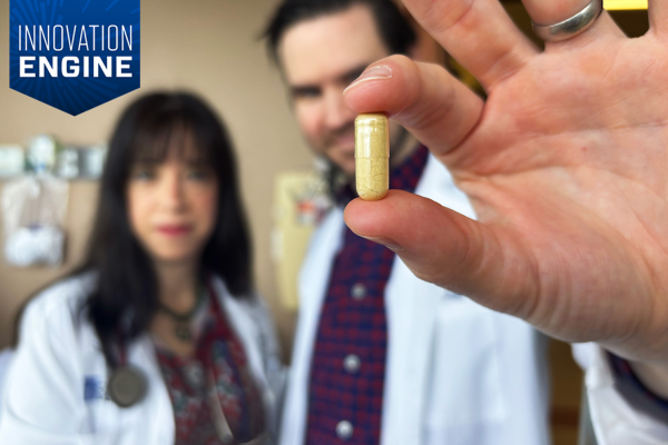 Photo of doctors with a psilocybin capsule