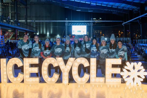 IceCycle team photo in front of light-up letters