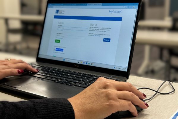 A person navigates the Roswell Park Patient Portal on a computer 