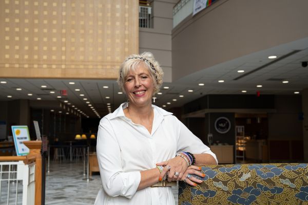 AML patient Lynette Koronowski smiles for a photo in the Roswell Park lobby