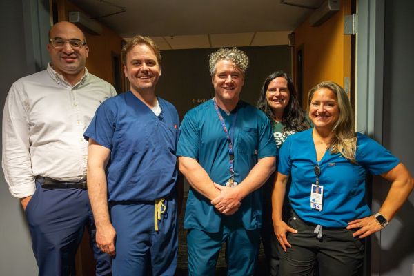 Nurses and doctors await to greet patients
