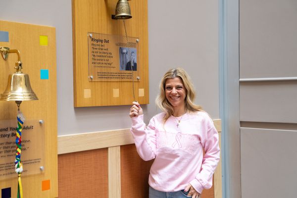 Dr. Laura Mango, Chief of the ATC and breast cancer survivor, rings the Victory Bell